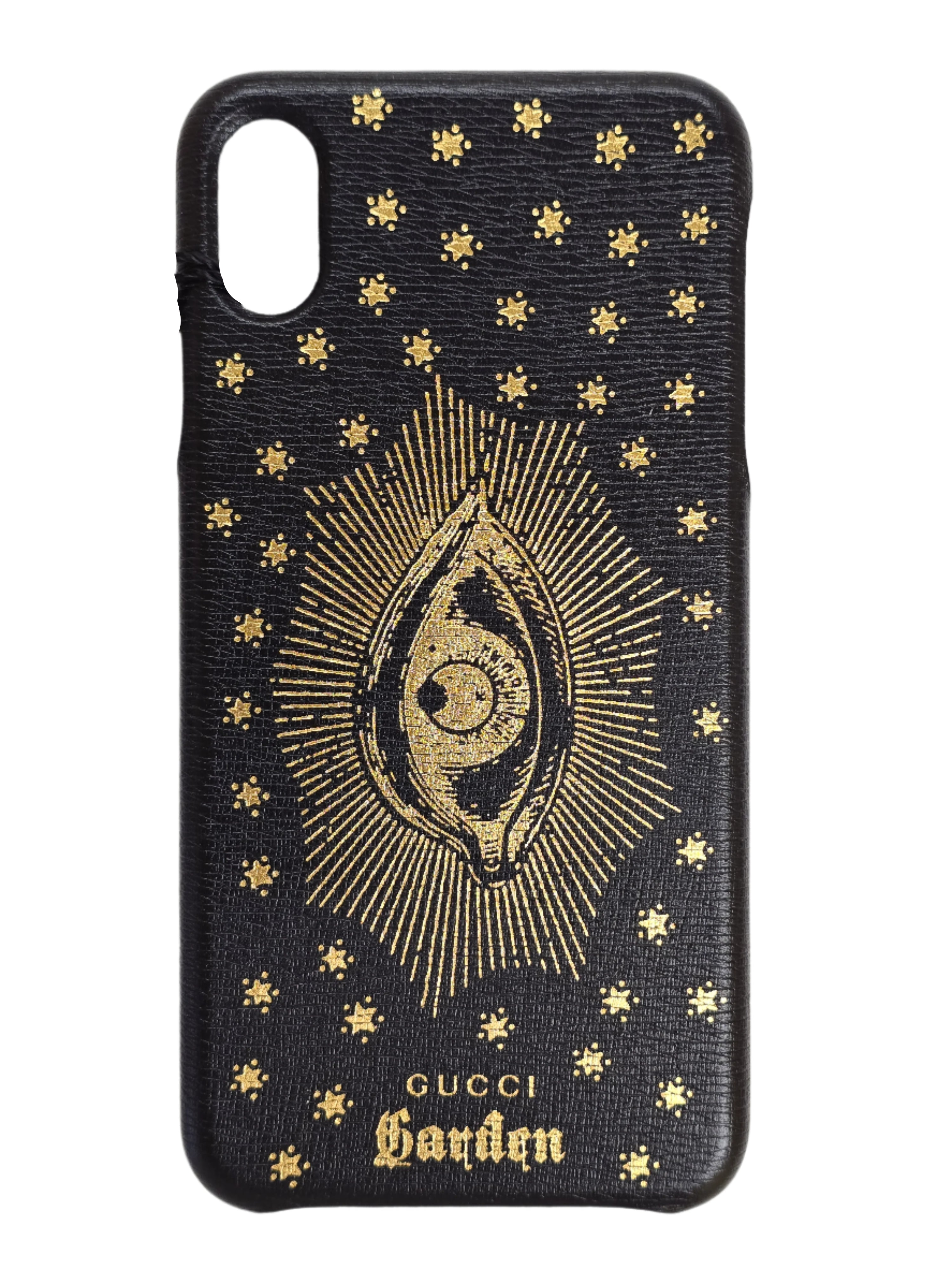 Black phone case with gold eye design and Gucci logo on a white surface